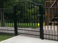 pca-black-with-puppy-pickets-and-arched-gate
